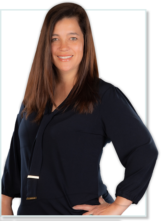 Renee Gray, founder of Hardware Store Marketing Experts, smiling and standing confidently in a professional setting. Renee is dedicated to helping local hardware stores thrive with her 25 years of marketing expertise.
